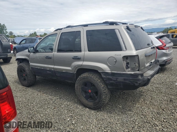 2000 Jeep Grand Cherokee Laredo with VIN 1J4GW48S9YC390448, listed as a Copart auction lot 56985265 with Not provided miles and Salvage title. Bid and sale history available at DreamBid. Image 2.