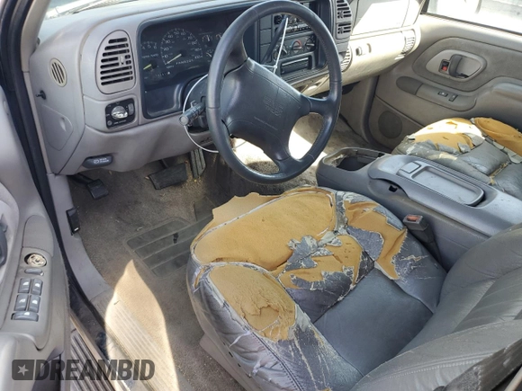 1997 GMC Suburban z VIN 1GKFK16R6VJ758513, wystawiony jako Copart lot #75034574 z przebiegiem 181 873 mil mil oraz Szkoda całkowita • Salvage title. Historia ofert i sprzedaży dostępna na DreamBid. Obrazek 8.