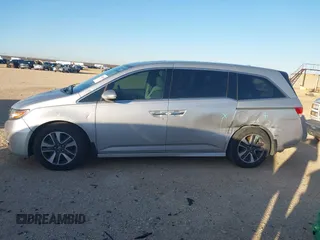 2014 Honda Odyssey Touring with VIN 5FNRL5H97EB094353, listed as a IAAI auction lot 41701712 with 141,228 mi miles and . Bid and sale history available at DreamBid. Image 15.