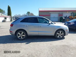 2015 Audi Q3 2.0T Premium Plus with VIN WA1EFCFSXFR010015, listed as a IAAI auction lot 42099410 with 142,117 mi miles. Bid and sale history available at carsss.com. Image 13.