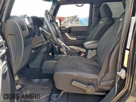 2015 Jeep Wrangler Unlimited Sahara with VIN 1C4BJWEG4FL668339, listed as a Copart auction lot 61221325 with 117,887 mi miles and Salvage title. Bid and sale history available at DreamBid. Image 7.
