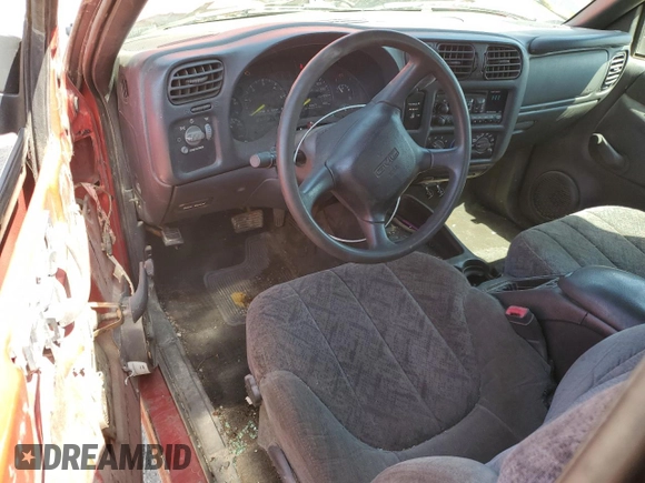 2000 GMC Sonoma SLS z VIN 1GTCS19W0Y8262960, wystawiony jako Copart lot #56512435 z przebiegiem 243 662 mil mil oraz Tytuł czysty. Historia ofert i sprzedaży dostępna na DreamBid. Obrazek 8.