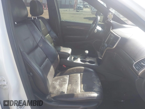 2015 Jeep Grand Cherokee Summit with VIN 1C4RJFJGXFC734025, listed as a IAAI auction lot 41842927 with 137,993 mi miles. Bid and sale history available at carsss.com. Image 5.
