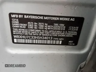2017 BMW X1 sDrive28i with VIN WBXHU7C33H5H34013, listed as a Copart auction lot 38409444 with 87,558 mi miles and Salvage Title. Bid and sale history available at carsss.com. Image 12.