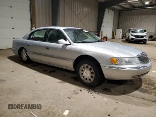 2001 Lincoln Continental with VIN 1LNHM97V51Y698794, listed as a Copart auction lot 47649315 with 84,465 mi miles and Salvage Title. Bid and sale history available at DreamBid. Image 4.