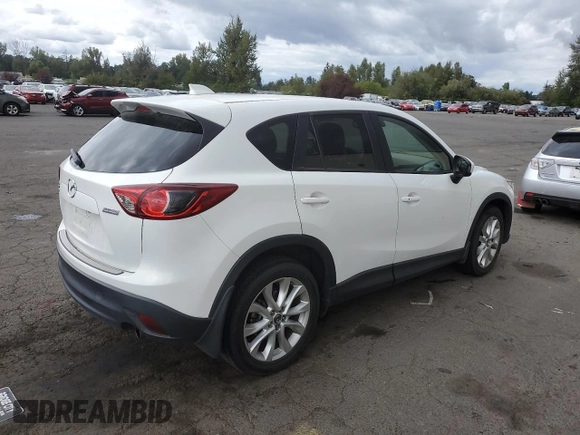 2014 Mazda CX-5 Grand Touring with VIN JM3KE4DY2E0354795, listed as a Copart auction lot 70713544 with 58,848 mi miles and Salvage Title. Bid and sale history available at DreamBid. Image 3.