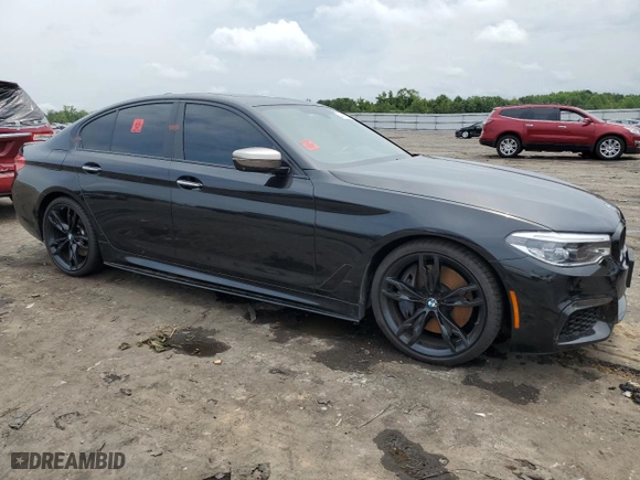 2018 BMW 5 Series M550i xDrive with VIN WBAJB9C51JB286700, listed as a Copart auction lot 64681004 with 76,304 mi miles and Salvage Title. Bid and sale history available at carsss.com. Image 4.