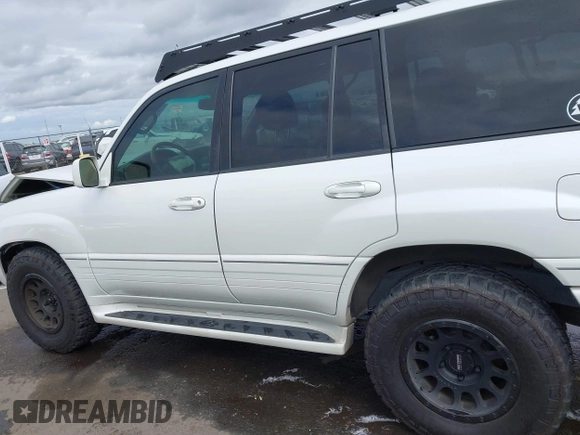 2004 Lexus LX 470 z VIN JTJHT00W043543915, wystawiony jako IAAI lot #41902858 z przebiegiem 110 454 mil mil oraz . Historia ofert i sprzedaży dostępna na DreamBid. Obrazek 15.