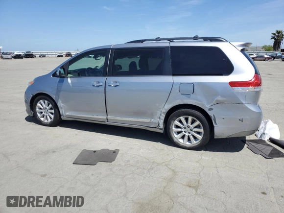 2013 Toyota Sienna XLE with VIN 5TDDK3DC2DS053531, listed as a Copart auction lot 54243695 with 110,000 mi miles and Salvage Title. Bid and sale history available at DreamBid. Image 2.