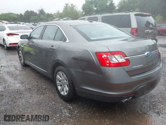 2011 Ford Taurus SE with VIN 1FAHP2DW2BG181059, listed as a IAAI auction lot 42036867 with 103,394 mi miles. Bid and sale history available at carsss.com. Image 3.