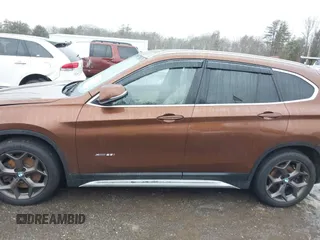 2016 BMW X1 xDrive28i with VIN WBXHT3C31GP881488, listed as a IAAI auction lot 41693116 with 120,922 mi miles. Bid and sale history available at carsss.com. Image 14.