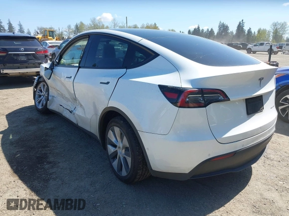 2022 Tesla Model Y Long Range z VIN 7SAYGDEE7NF418223, wystawiony jako IAAI lot #42046651 z przebiegiem 18 724 mil mil oraz . Historia ofert i sprzedaży dostępna na DreamBid. Obrazek 3.