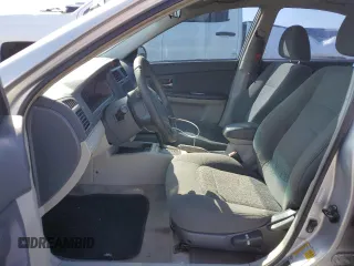 2006 Kia Spectra EX with VIN KNAFE121365229594, listed as a Copart auction lot 77311084 with 129,789 mi miles and Salvage Title. Bid and sale history available at carsss.com. Image 7.