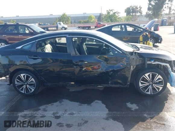 2016 Honda Civic Sedan EX-L with VIN 19XFC1F73GE215112, listed as a IAAI auction lot 42093218 with 67,233 mi miles. Bid and sale history available at carsss.com. Image 14.