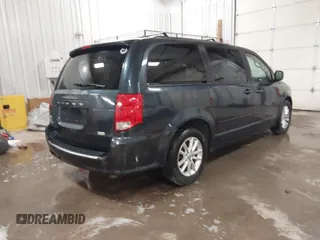 2014 Dodge Grand Caravan SXT with VIN 2C4RDGCGXER154709, listed as a IAAI auction lot 41117603 with 214,872 mi miles and . Bid and sale history available at DreamBid. Image 4.