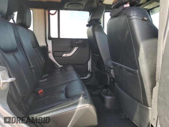 2014 Jeep Wrangler Unlimited Sahara with VIN 1C4HJWEG1EL126611, listed as a Copart auction lot 57169485 with 122,000 mi miles and Salvage title. Bid and sale history available at DreamBid. Image 10.