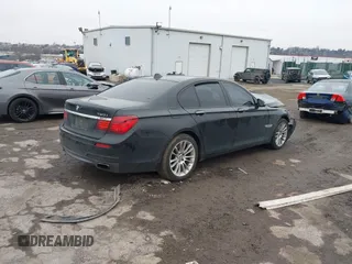2015 BMW 7 Series 750i xDrive with VIN WBAYB6C59FD965820, listed as a IAAI auction lot 41558215 with 142,617 mi miles. Bid and sale history available at carsss.com. Image 4.