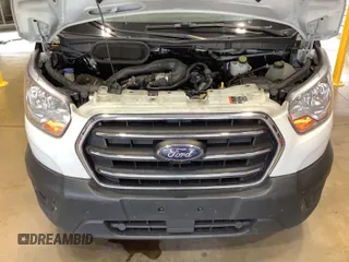 2020 Ford Transit Cargo z VIN 1FTBR1Y8XLKB06141, wystawiony jako IAAI lot #42642640 z przebiegiem 123 417 mil mil oraz . Historia ofert i sprzedaży dostępna na DreamBid. Obrazek 2.