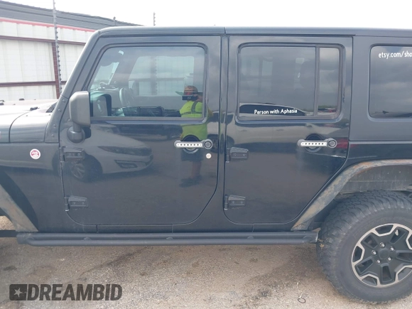 2015 Jeep Wrangler Unlimited Rubicon z VIN 1C4BJWFG2FL572417, wystawiony jako IAAI lot #41895927 z przebiegiem 54 981 mil mil oraz . Historia ofert i sprzedaży dostępna na DreamBid. Obrazek 14.