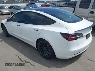 2021 Tesla Model 3 Performance with VIN 5YJ3E1EC2MF084594, listed as a IAAI auction lot 42030339 with 43,215 mi miles and . Bid and sale history available at DreamBid. Image 3.