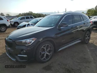 2018 BMW X1 xDrive28i with VIN WBXHT3C33J5F90612, listed as a Copart auction lot 74937654 with 72,561 mi miles and Salvage Title. Bid and sale history available at carsss.com. Image 1.