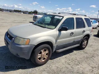 2004 Ford Escape XLT with VIN 1FMYU03104KA53587, listed as a Copart auction lot 51777385 with 154,102 mi miles and Salvage Title. Bid and sale history available at carsss.com. Image 1.