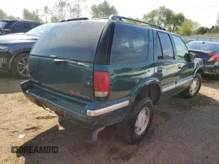 1996 GMC Jimmy SL with VIN 1GKCS13W0T2553905, listed as a Copart auction lot 71007674 with 169,513 mi miles and Salvage Title. Bid and sale history available at carsss.com. Image 3.