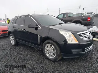 2015 Cadillac SRX Luxury Collection z VIN 3GYFNEE31FS525351, wystawiony jako IAAI lot #41977776 z przebiegiem 156 396 mil mil oraz . Historia ofert i sprzedaży dostępna na DreamBid. Obrazek 1.