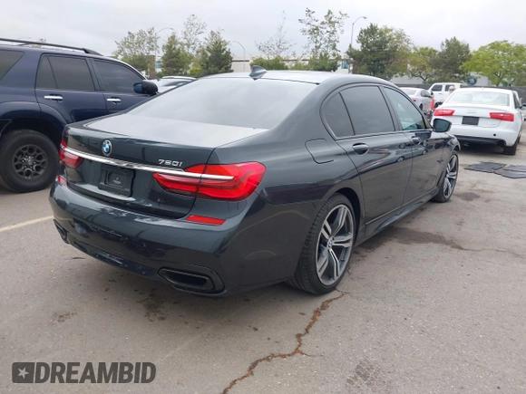 2019 BMW 7 Series 750i with VIN WBA7F0C50KGM26010, listed as a IAAI auction lot 42188421 with 71,576 mi miles and . Bid and sale history available at DreamBid. Image 4.