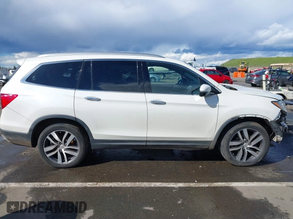 2017 Honda Pilot Elite with VIN 5FNYF6H06HB041609, listed as a IAAI auction lot 41804477 with 134,535 mi miles and . Bid and sale history available at DreamBid. Image 14.