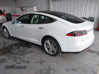 2014 Tesla Model S 60 with VIN 5YJSA1S16EFP53350, listed as a IAAI auction lot 42239753 with 104,985 mi miles and . Bid and sale history available at DreamBid. Image 3.