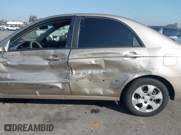 2004 Kia Spectra LX with VIN KNAFE122145013930, listed as a IAAI auction lot 41627031 with 93,565 mi miles. Bid and sale history available at carsss.com. Image 12.