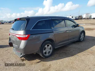 2011 Honda Odyssey Touring with VIN 5FNRL5H93BB104436, listed as a IAAI auction lot 40426003 with 93,342 mi miles and . Bid and sale history available at DreamBid. Image 4.