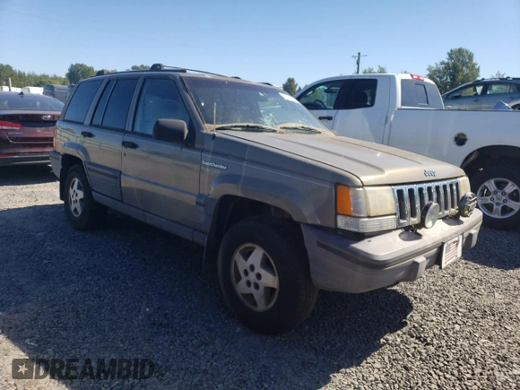 1995 Jeep Grand Cherokee Laredo with VIN 1J4FX58S1SC754691, listed as a Copart auction lot 72858214 with 251,234 mi miles and Salvage Title. Bid and sale history available at carsss.com. Image 4.