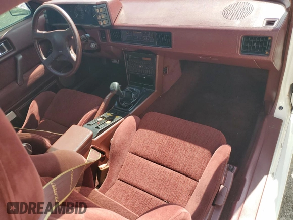 1988 Chrysler Conquest z VIN JJ3CC54N7JZ039025, wystawiony jako Copart lot #66072584 z przebiegiem 79 407 mil mil oraz Szkody całkowita. Historia ofert i sprzedaży dostępna na DreamBid. Obrazek 8.