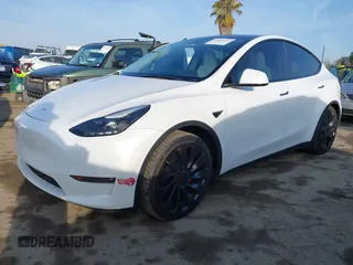 2023 Tesla Model Y Performance with VIN 7SAYGDEF0PF839468, listed as a IAAI auction lot 41609263 with 25,434 mi miles and . Bid and sale history available at DreamBid. Image 20.