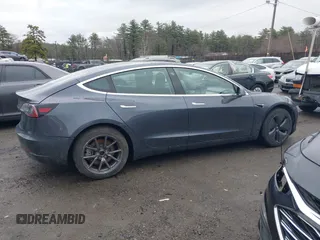 2019 Tesla Model 3 Mid Range with VIN 5YJ3E1EA3KF307415, listed as a IAAI auction lot 41673239 with 42,895 mi miles and . Bid and sale history available at DreamBid. Image 13.