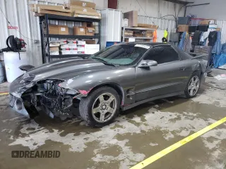 1999 Pontiac Firebird Formula z VIN 2G2FV22G1X2211237, wystawiony jako Copart lot #57750415 z przebiegiem 134 236 mil mil oraz Szkoda całkowita • Salvage title. Historia ofert i sprzedaży dostępna na DreamBid. Obrazek 1.