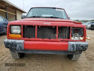 1999 Jeep Cherokee Sport with VIN 1J4FT68S2XL580915, listed as a Copart auction lot 50374875 with 286,276 mi miles and Salvage Title. Bid and sale history available at carsss.com. Image 5.