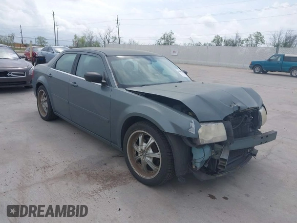 2006 Chrysler 300 with VIN 2C3KA43R56H217771, listed as a IAAI auction lot 41859397 with 154,227 mi miles. Bid and sale history available at carsss.com. Image 1.