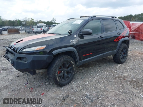 2015 Jeep Cherokee Trailhawk with VIN 1C4PJMBS5FW792184, listed as a IAAI auction lot 41827106 with 132,752 mi miles. Bid and sale history available at carsss.com. Image 17.