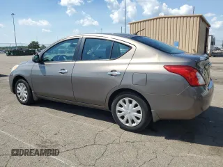 2012 Nissan Versa SV with VIN 3N1CN7AP7CL930619, listed as a Copart auction lot 63657855 with 106,911 mi miles and Salvage title. Bid and sale history available at DreamBid. Image 2.