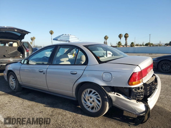 1999 Saturn SL with VIN 1G8ZK5274XZ367394, listed as a Copart auction lot 63863795 with 73,197 mi miles and Salvage title. Bid and sale history available at DreamBid. Image 2.