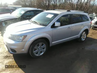 2014 Dodge Journey Limited with VIN 3C4PDCDG9ET157841, listed as a IAAI auction lot 41609646 with 130,329 mi miles and . Bid and sale history available at DreamBid. Image 2.