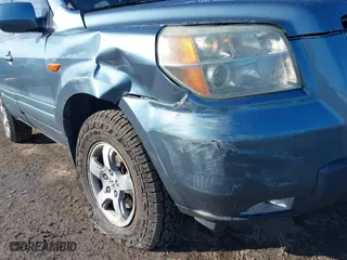 2006 Honda Pilot EX-L with RES with VIN 2HKYF18666H511059, listed as a IAAI auction lot 41719613 with 143,084 mi miles. Bid and sale history available at carsss.com. Image 6.