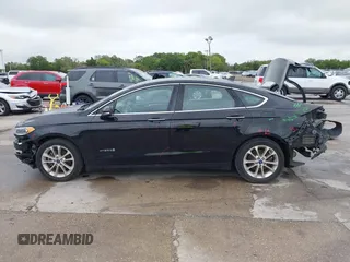 2019 Ford Fusion Hybrid SEL with VIN 3FA6P0MU1KR202860, listed as a IAAI auction lot 41983299 with 133,671 mi miles. Bid and sale history available at carsss.com. Image 15.