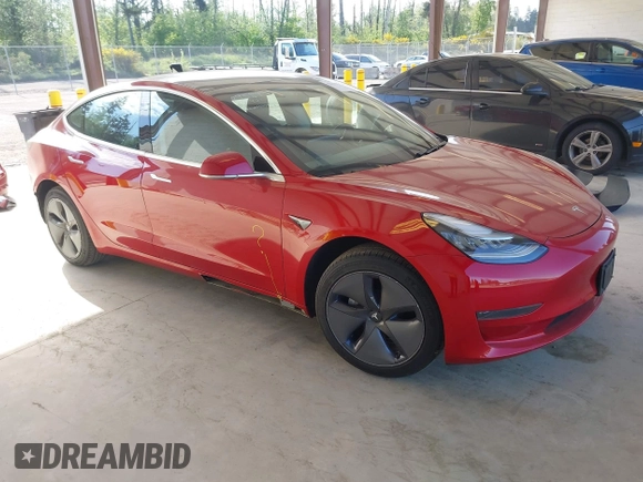 2020 Tesla Model 3 Standard Range Plus z VIN 5YJ3E1EA7LF611669, wystawiony jako IAAI lot #42179974 z przebiegiem 17 696 mil mil oraz . Historia ofert i sprzedaży dostępna na DreamBid. Obrazek 1.