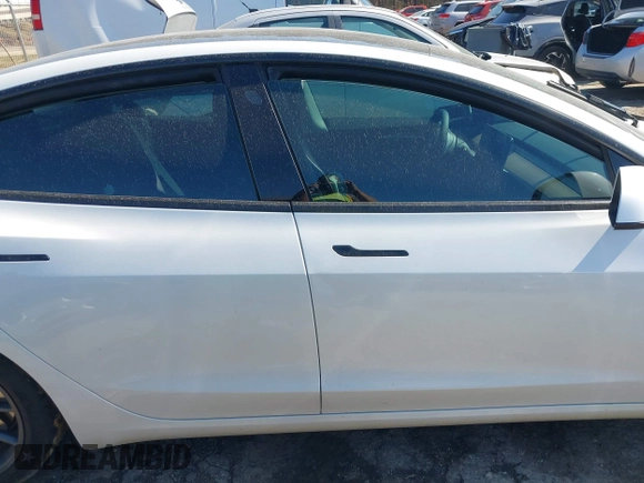 2023 Tesla Model 3 Long Range with VIN 5YJ3E1EB1PF393565, listed as a IAAI auction lot 41656060 with 16,236 mi miles and . Bid and sale history available at DreamBid. Image 13.