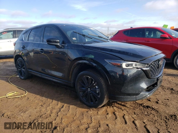 2022 Mazda CX-5 2.5 Turbo with VIN JM3KFBAY5N0647340, listed as a Copart auction lot 85123474 with 68,510 mi miles and Salvage Title. Bid and sale history available at carsss.com. Image 4.
