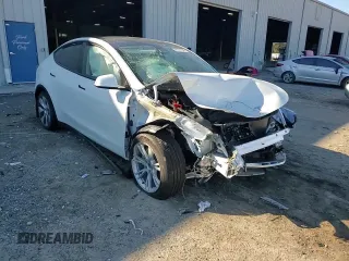 2023 Tesla Model Y Long Range z VIN 7SAYGAEE1PF810888, wystawiony jako Copart lot #88991735 z przebiegiem Nie podano mil oraz Nie do naprawy • Non repairable. Historia ofert i sprzedaży dostępna na DreamBid. Obrazek 11.